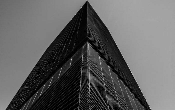 A low angle grayscale shot of a business building