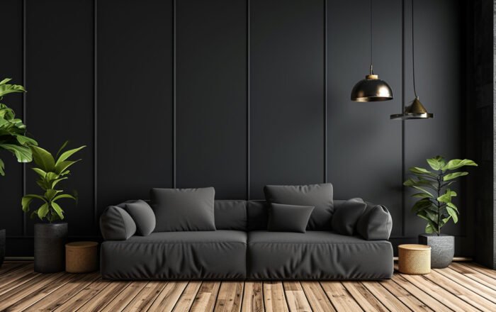 A minimalist black interior with a black sofa